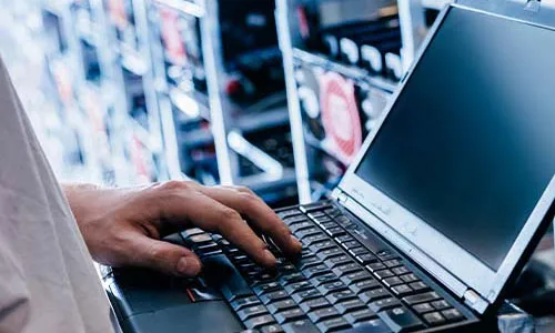 Image of a person at a laptop