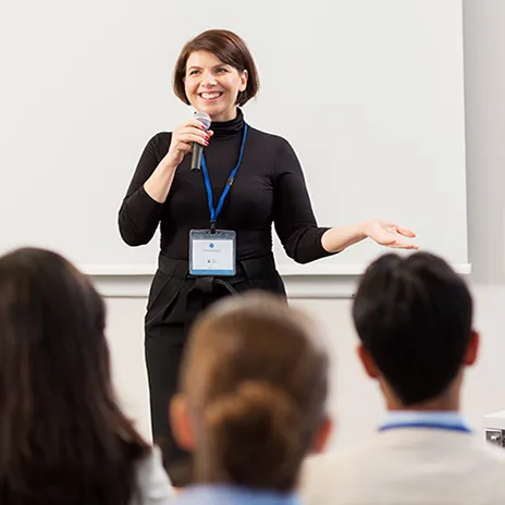 Woman giving a talk to students
