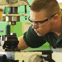 Student working machinery