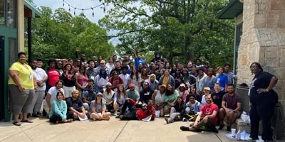 Students pose for a group photo at an event