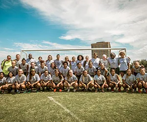 The Brookhaven women's soccer team takes a team photo in front of a goal