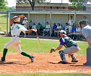 A North Lake baseball player swings at a ball