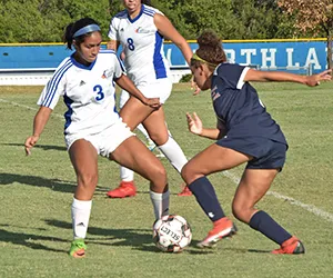 A North Lake women's soccer player tries to keep the ball from an opponent