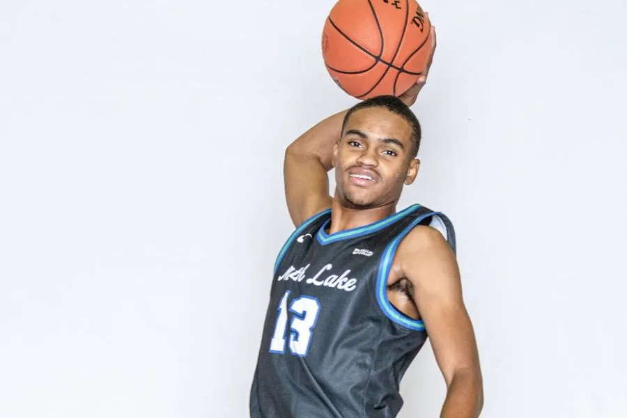 A North Lake Basketball player jumps to dunk the ball