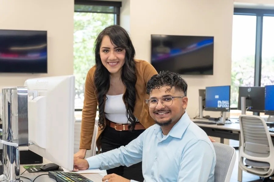 Students work together in a computer lab on campus