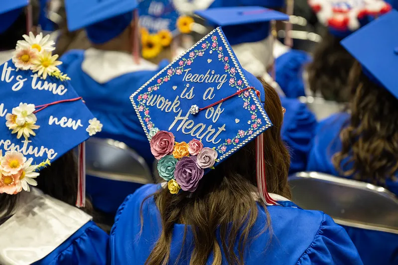 A graduation cap says Teaching is a Work of Heart