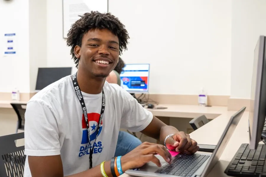 Student studies on a laptop in a computer lab