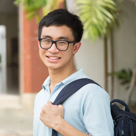 Close up of a student wearing a back pack over his left shoulder