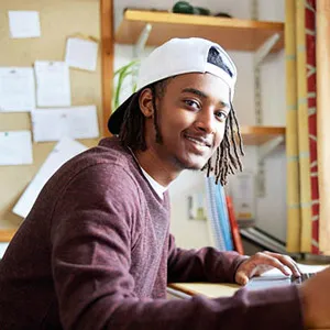 Student sitting at a desk in a study environment