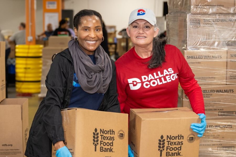 Employees box food items at the local food bank