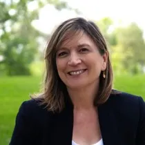 smiling woman in blzaer