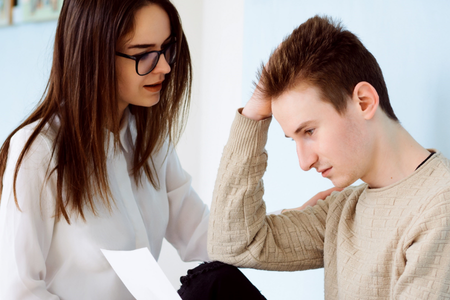 An advisor counsels a struggling student