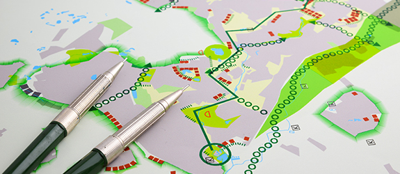A map with a pen laying on top of it that highlights specific land use