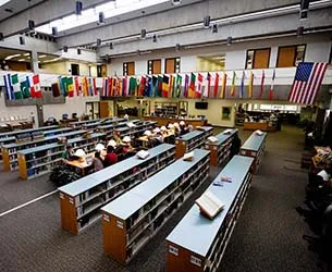 An overhead view of the Richland library with shelves of books and students studying