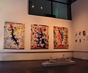 The Brookhaven art gallery with three paintings on the wall