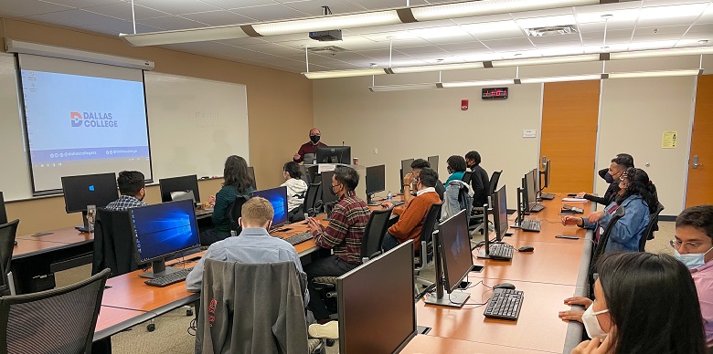 Classroom with students, presenter and screen.