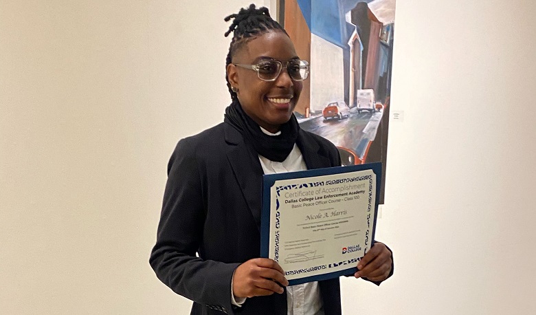 Nicole Harris holding certificate.