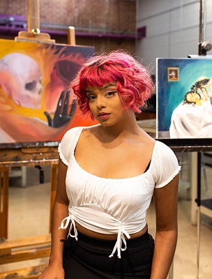 Arianna Castillo posing in a studio.