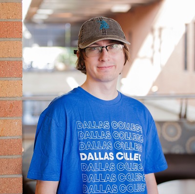 Jesse Serrano wearing Dallas College t-shirt and ball cap.
