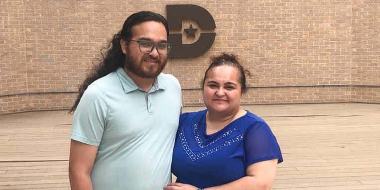 Kevin and Luz Valley standing in front of Dallas College building.
