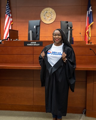 Judge Vonda Bailey showing Dallas College t-shirt under her robe.