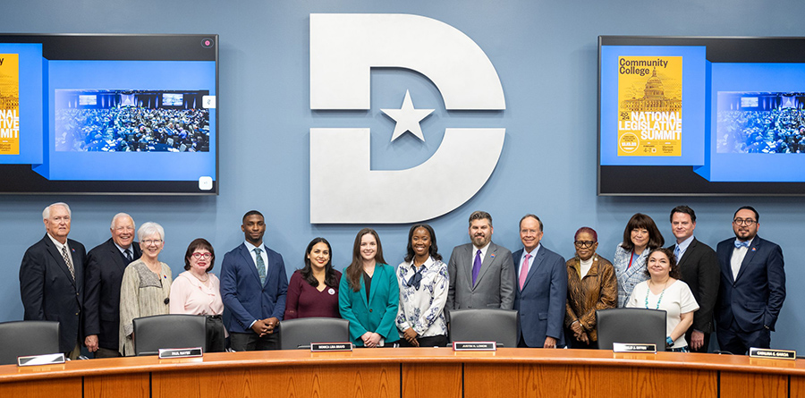 4 Dallas College students who represented Dallas College at the National Legislative Summit take a picture in the board room with the Dallas College board members.
