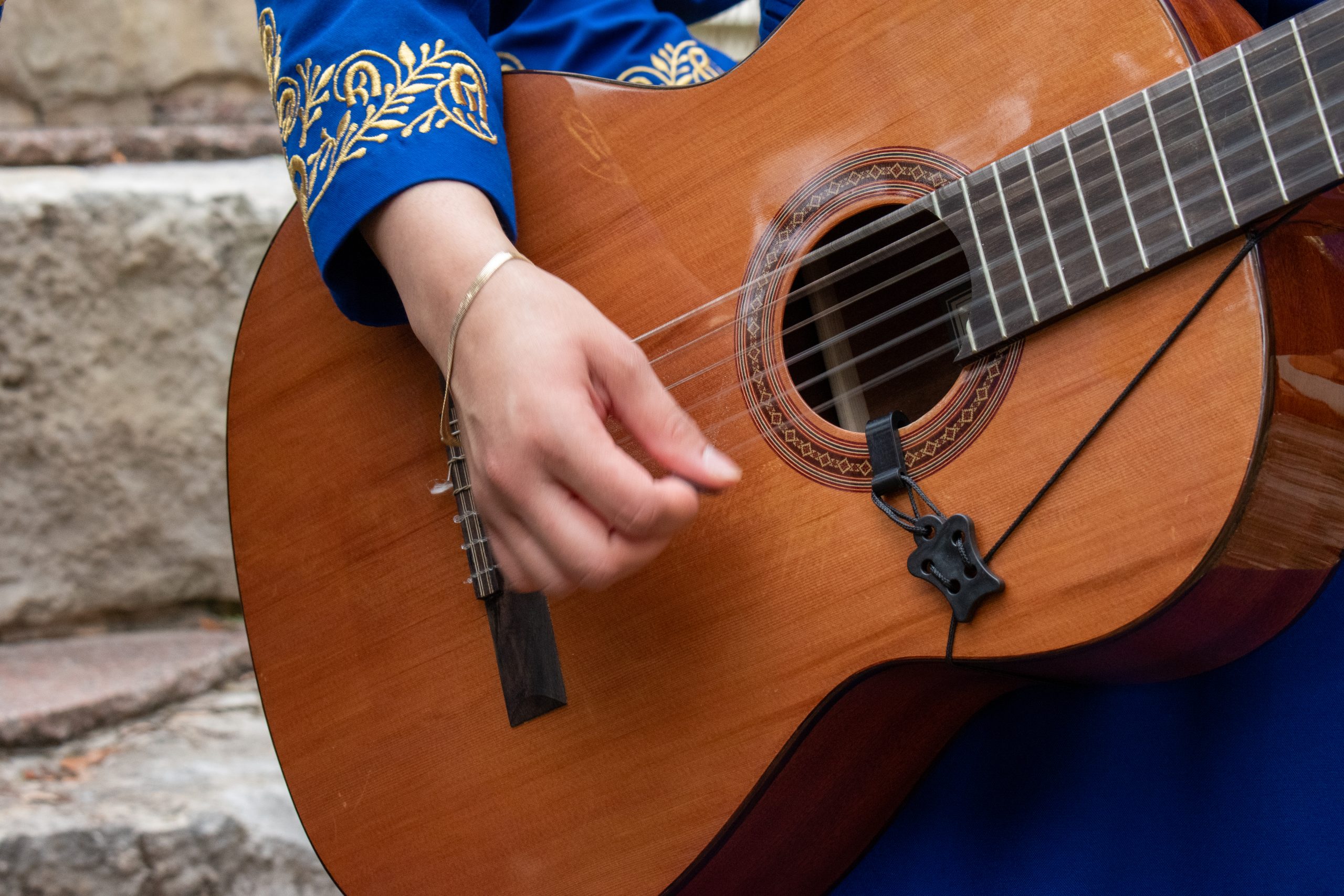 Close up shot of someone playing guitar.