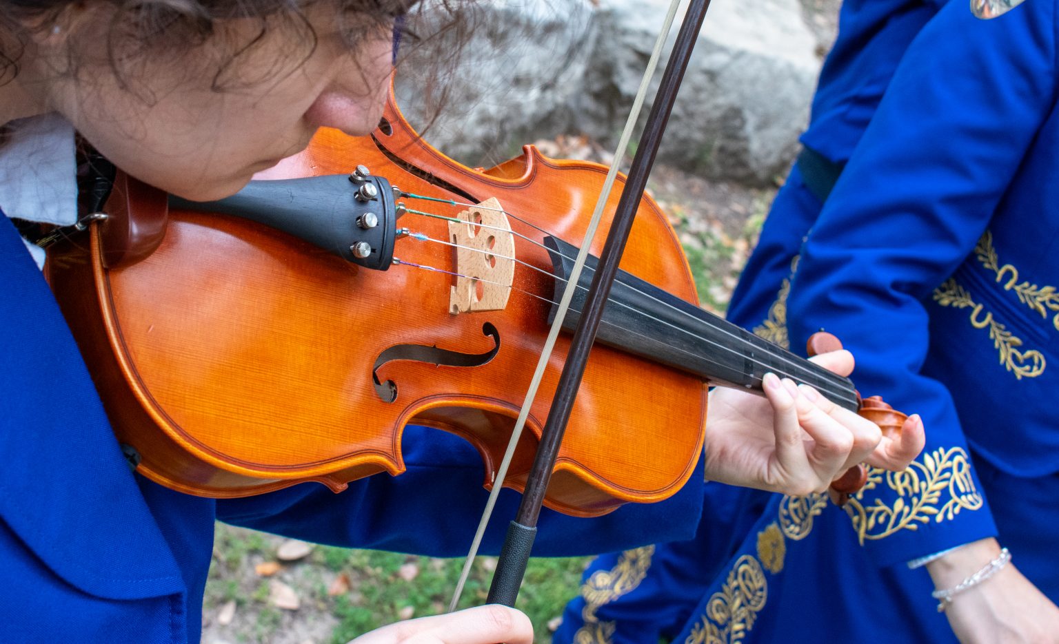 Close up shot of person playing violin.