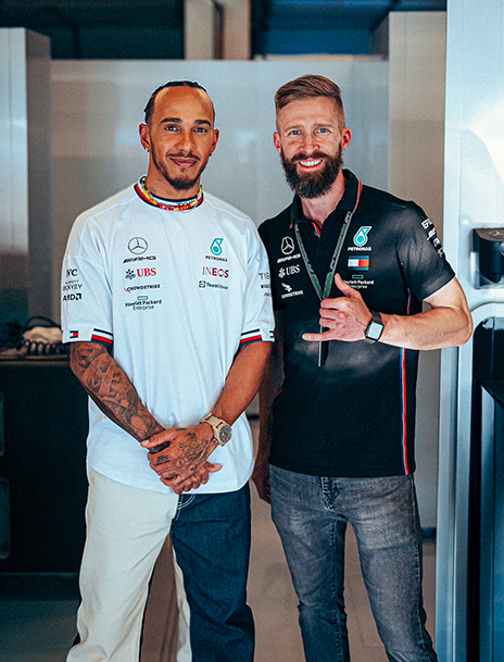 Chris Manning with race car driver Lewis Hamilton.