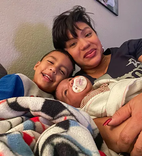 Cichez Dounley with two grandchildren.