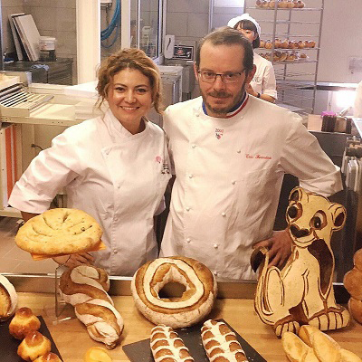 Sayada Rapalo and another chef show loafs of bread.