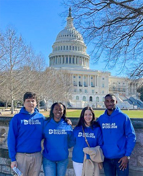 Dallas College students in blue Dallas College hoodies standing front of the Capital building in Washington, DC.