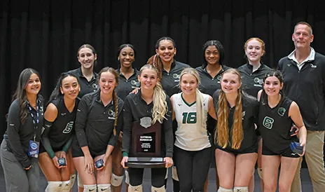 Brookhaven volleyball team poses with trophy.
