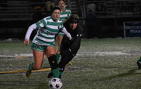 Brookhaven soccer player kicking ball during game