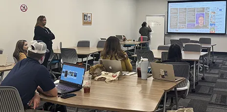 Students at tables in classroom