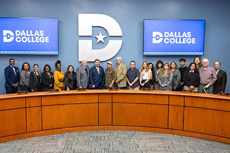 Journalism students are photographed with Dallas College Board of Trustees at the board meeting.