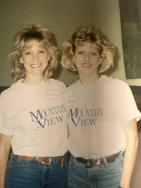 Two ladies pose for photo