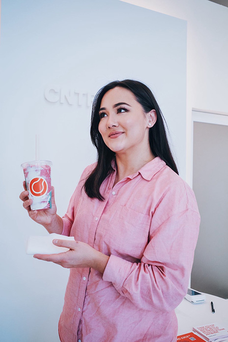 Veronica Ume-Ezeoke with a bottle of her juice.