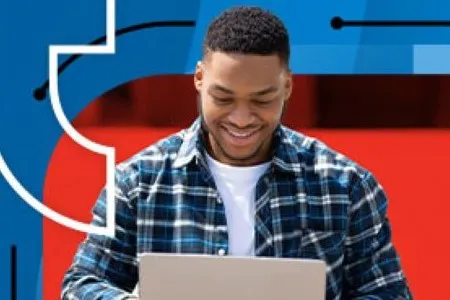 Student works on a laptop with abstract Dallas College branding behind him