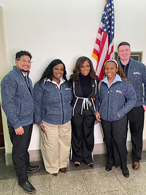 Dallas College students are pictured with U.S. Representative Jasmine Crockett
