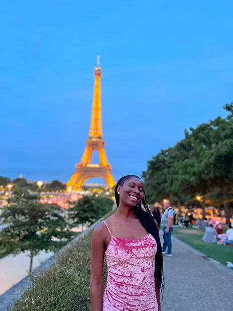 Emmanuella Iwuji posing in front of Eiffel Tower.