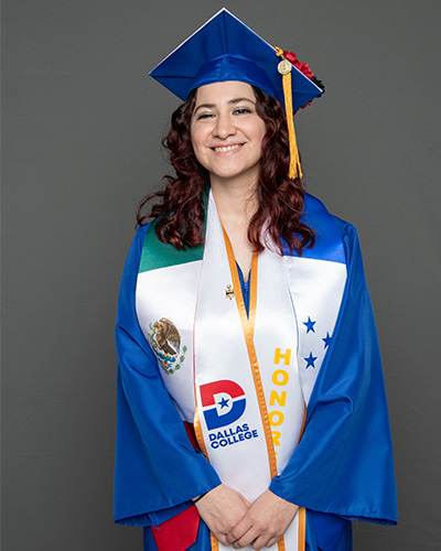 Jennifer Andrade is pictured wearing a cap and gown