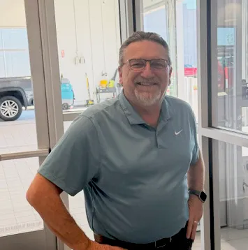 Joey Patterson standing in his office.