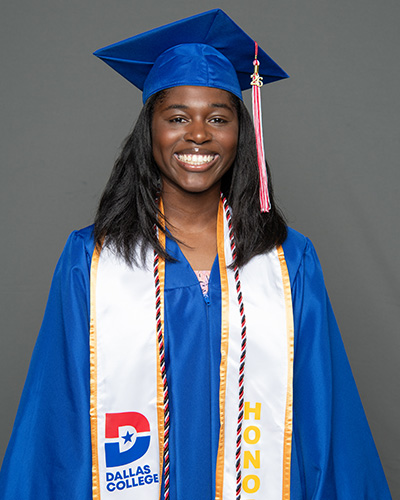 Raina Williams is pictured wearing a cap and gown