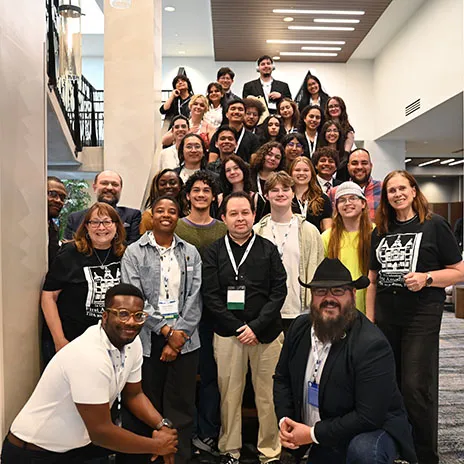 Students at TIPA posing on stairs.