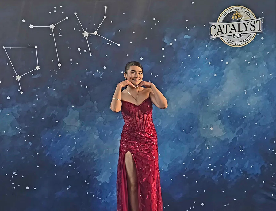 Torres poses in front of PTK Catalyst backdrop