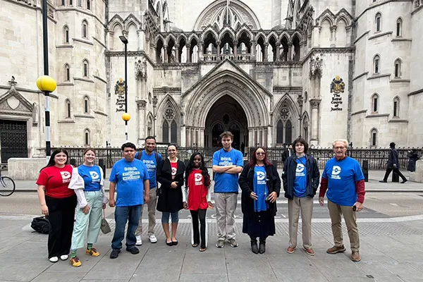 Dallas College students stand outside the Royal Courts of Justice in London.