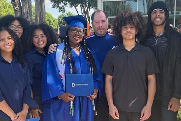 Tamara Gilreath is pictured in her cap and gown with her family on graduation day.