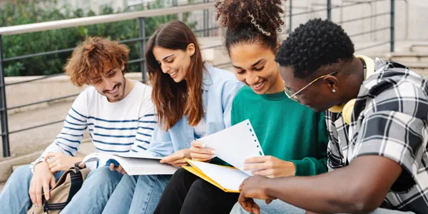 students applying to College by filling out their applications together