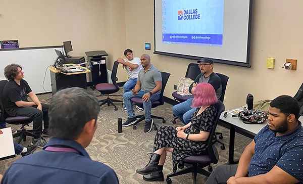 group of speakers presenting to a class